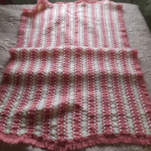 Knitted handmade crib blanket used pink white