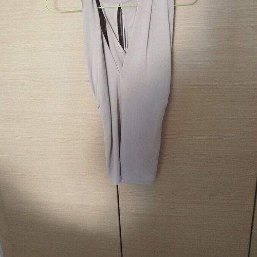 Sleeveless blouse with twisted design beige, like new, sizes S/M
