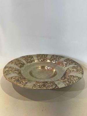 Vintage metal centerpiece used with ornate embossed motifs