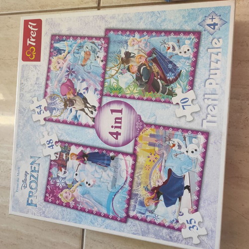 Frozen puzzle set like new with Ravensburger and Trefl
