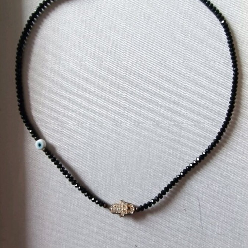 Necklace with black stones like new, eye and symbol