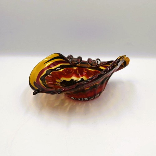 Glass ashtray used red with shell design