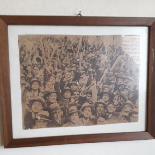 Newspaper scrap used from 1932 student rally in wooden frame