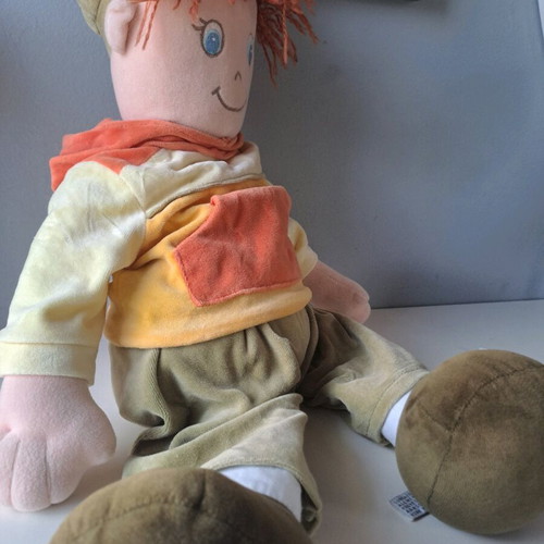 Cloth doll with hat and orange details like new
