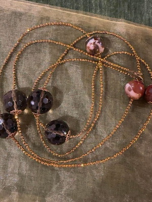 Elegant long necklace with crystals and decorative beads
