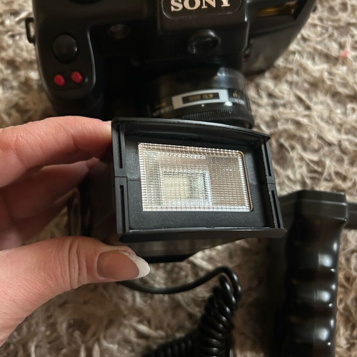 Sony camera like new with handle, flash, and bag