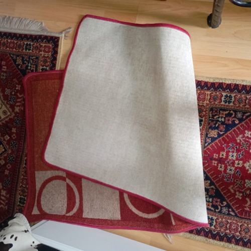 Vintage carpet runner used with geometric motifs in warm colors