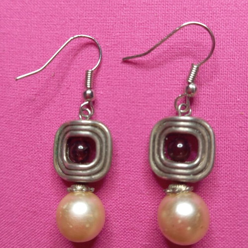 Silver earrings with red stone used