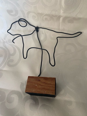 Dog wire sculpture with black wire on wooden base