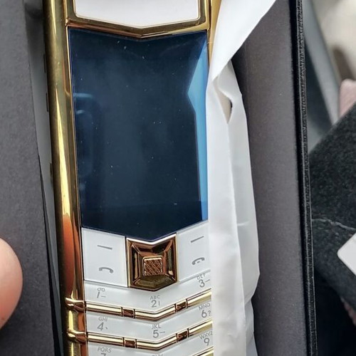 Vertu phone new, gold with metal leather body and dual card slot