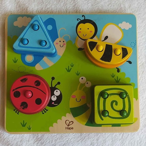 HAPE wooden sorting toy used with colors and shapes