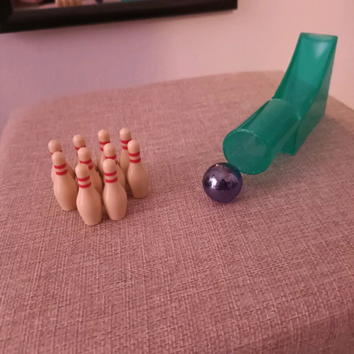 Mini bowling game like new with 10 pins, ball and slide
