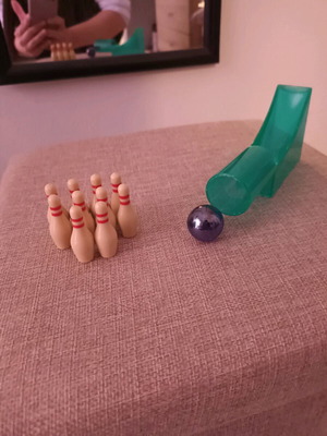 Mini bowling game like new with 10 pins, ball and slide