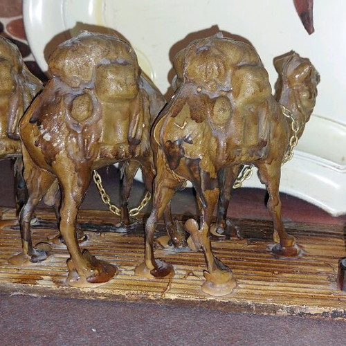 Decorative item used with camels and palm tree made of wood and plastic