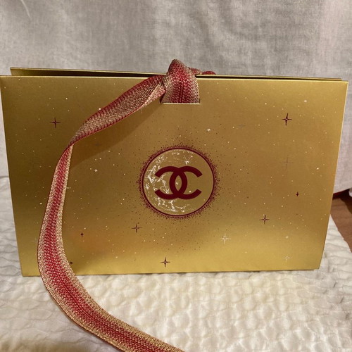 Chanel gift box new in gold color with ribbon