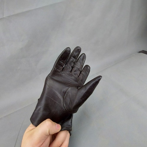 Women's dark brown leather gloves used