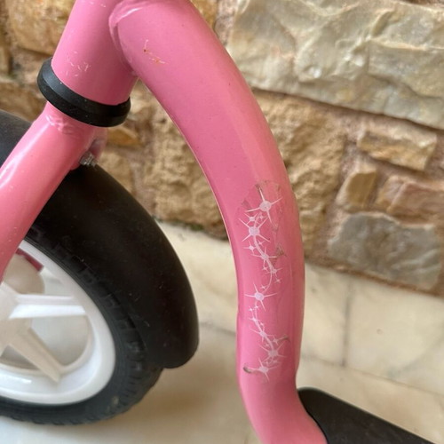 Balance bike pink like new with minor scratches on handlebar