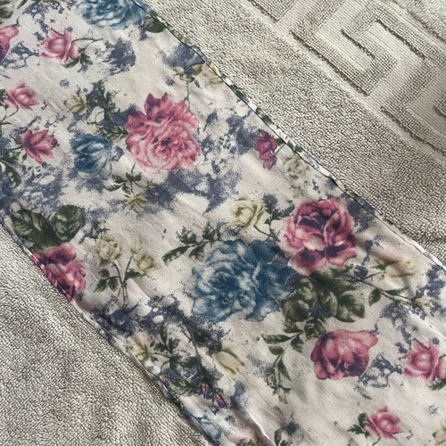 Bath towel used, light blue with printed fabric border