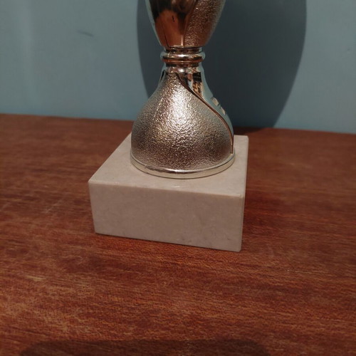 Trophy like new with metal, plastic, and marble parts