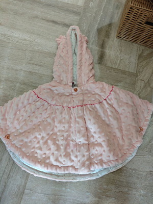 Baby poncho for 9-month-old girl, unused