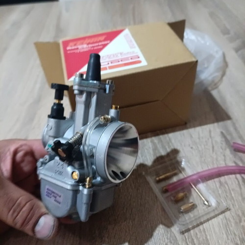 Carburetor 24mm new with extra needle, jet, neck, screws, and rubber mouth