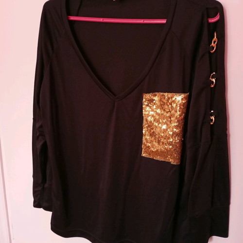 Black elastic blouse with sequin pocket and cutout, like new