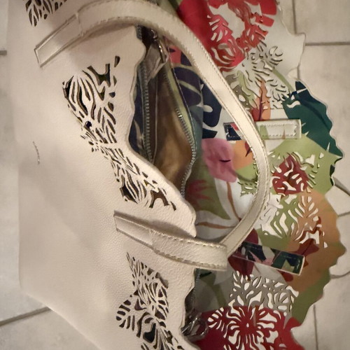 Caprisa shoulder bag used with floral inner pouch, white