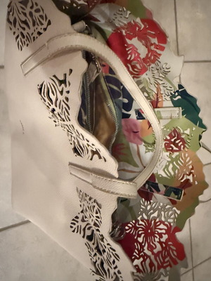 Caprisa shoulder bag used with floral inner pouch, white
