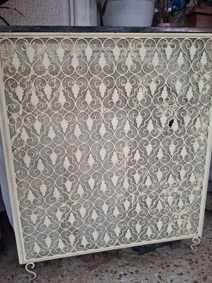Vintage metal radiator cover with embossed design