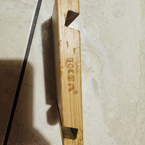 Bamboo phone and tablet stand used with two slots