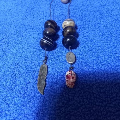 Handmade Greek begleri with natural agate beads and decorative feather charm
