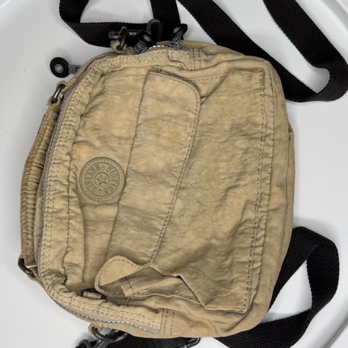 Kipling beige crossbody bag used with multiple compartments and strap