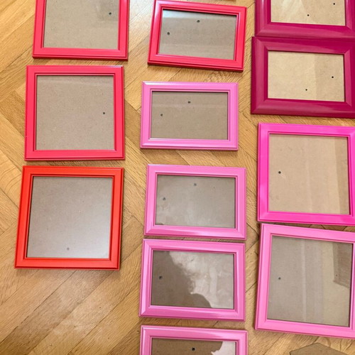 Set of 16 used wall frames in pink and red shades