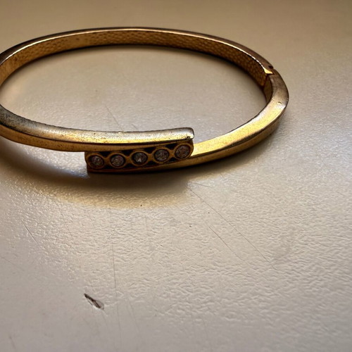 Gold-tone bracelet with white stones