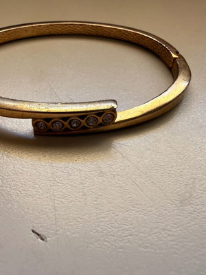 Gold-tone bracelet with white stones
