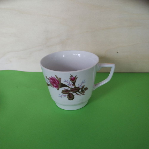 Vintage porcelain cup with roses and angled handle like new