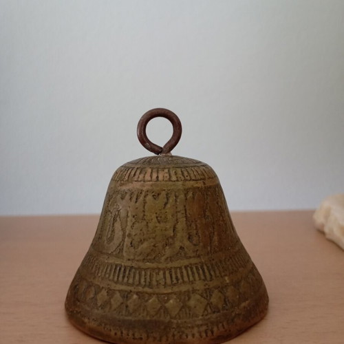 Vintage brass bell with embossed geometric designs like new