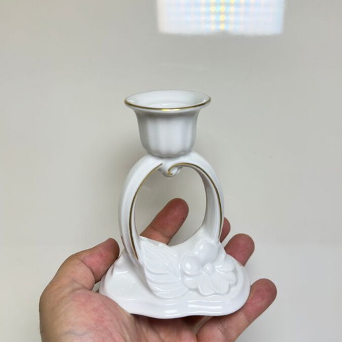 Porcelain candlestick with gilded floral decoration