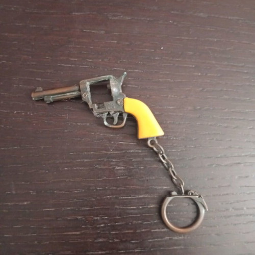 Vintage metal keychain gun used with cap gun function