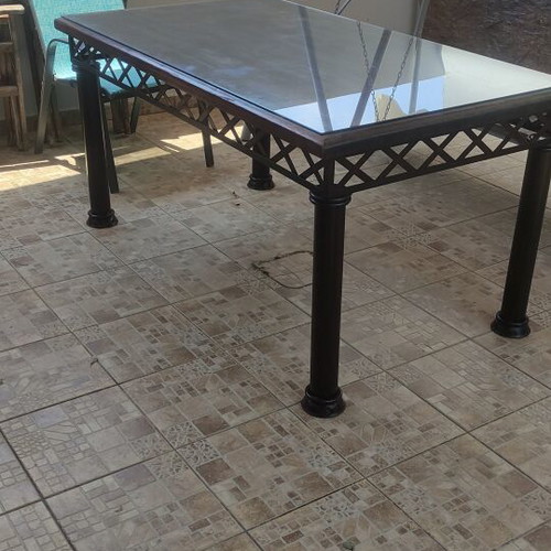 Table with solid iron base and solid teak wood top like new
