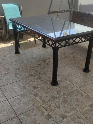 Table with solid iron base and solid teak wood top like new