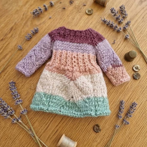Handmade knitted doll clothes in various colors