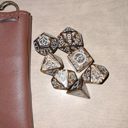 Brown leather dice bag with golden coffee D&D dragon dice