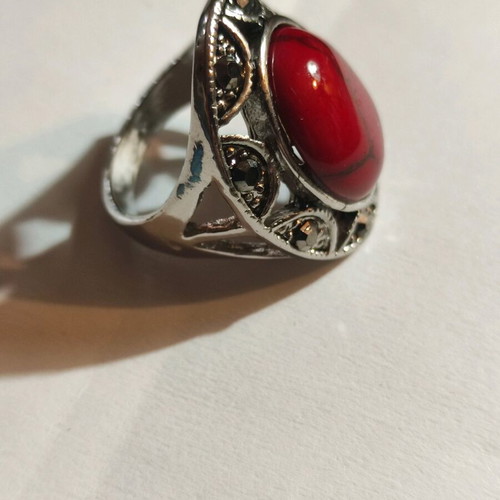 Silver-plated ring with red stone and small crystals new
