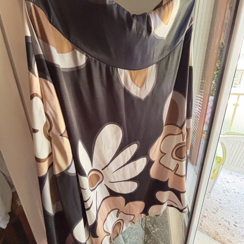 Women's skirt knee-length, airy, flared, like new, with large floral print