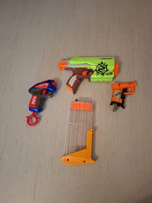 Nerf Zombie Strike Sidestrike Blaster used with two small Nerf and magazine