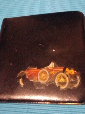 Leather tobacco case used with wear on car image