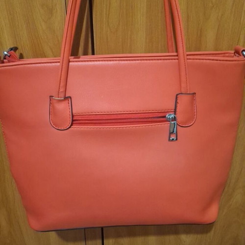 Red shoulder bag used with multiple compartments and zippers