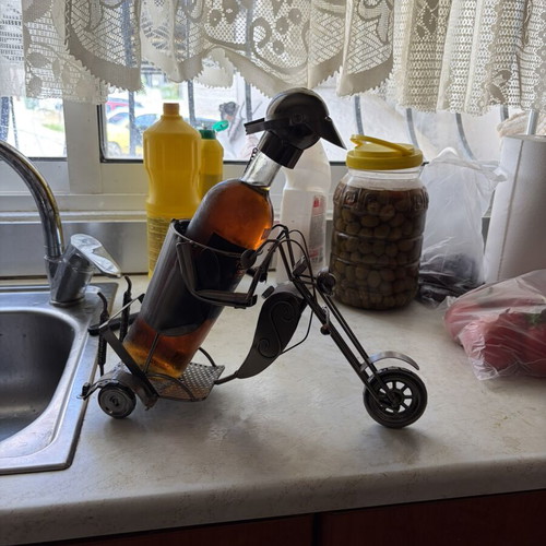 Metal decorative bottle holder in tricycle shape like new