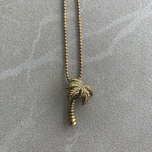 Gold-tone palm tree necklace like new